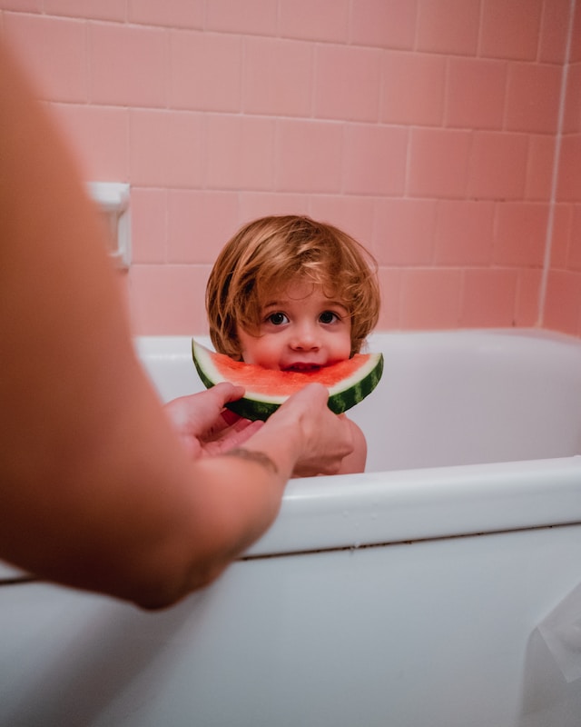 watermelon service to baby. Photo by Kyle Nieber on Unsplash.